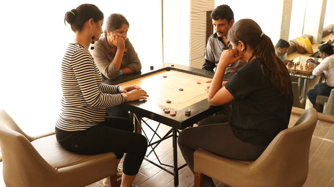 Play Carrom - Indoor Game at Della Adventure Park 