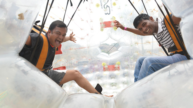 Experience Land zorbing at Della Adventure Park